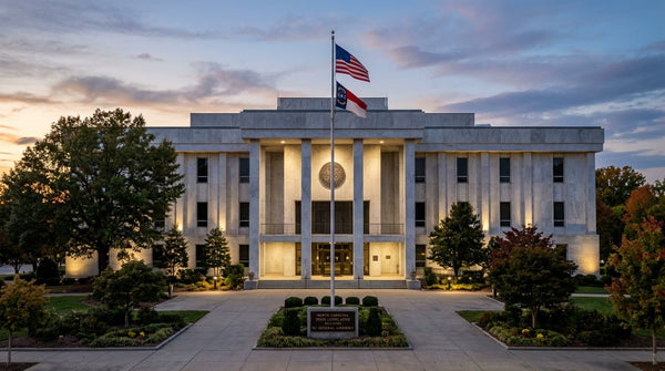 Exterior view of the North Carolina State Legislative Building in Raleigh at dusk during the General Assembly adjournment.